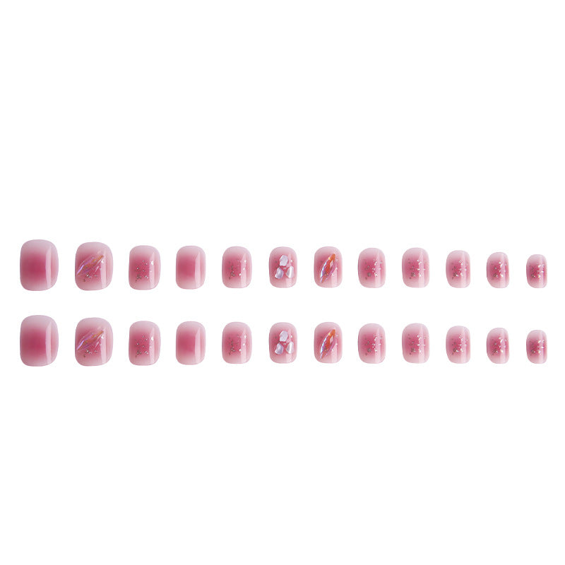 Artificial nails with delicate glitter design and floral accent Acalora