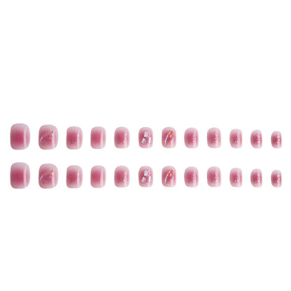 Artificial nails with delicate glitter design and floral accent Acalora
