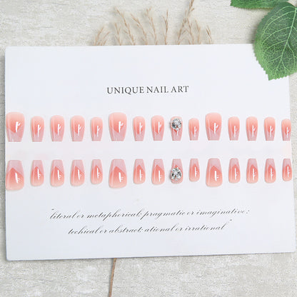 Artificial nail set with filigree tip designs and glamorous rhinestone accents Acalora