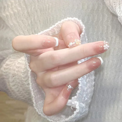 Nail set with elegant flower appliqués and exquisite glitter embellishments Acalora