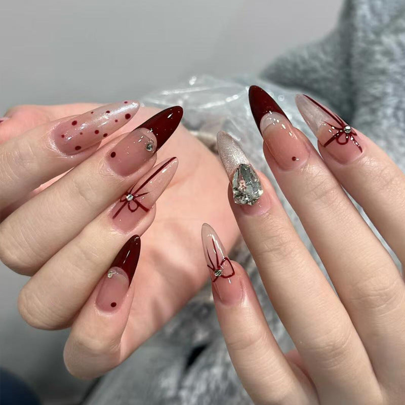 Artificial nail set with elegant bow and glitter details Acalora