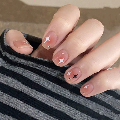 Acrylic nail set with sparkling star decorations and elegant accents Acalora