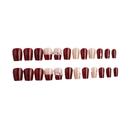 Glamorous artificial nails with glitter and pearl decorations Acalora