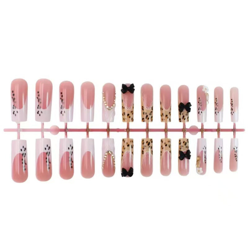 Artistic Press-On Nail Design with Bow and Animal Print Accents Acalora
