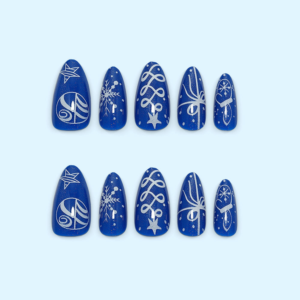 Artificial nails in festive winter design with glittering snowflakes and elegant decorations Acalora