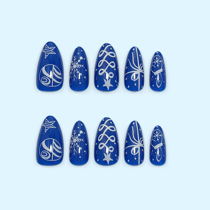 Artificial nails in festive winter design with glittering snowflakes and elegant decorations Acalora