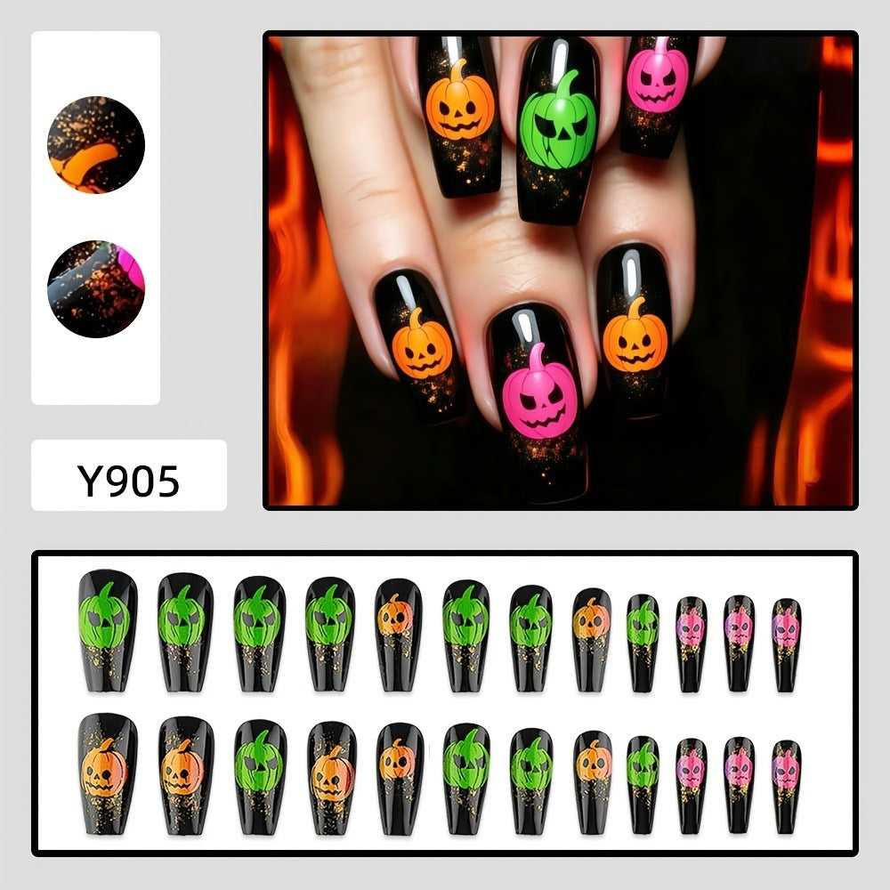 Halloween-style artificial nails with graphic pumpkin designs Acalora