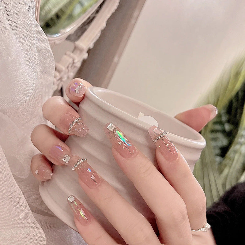 Acrylic nail set with glamorous rhinestone and glitter elements Acalora