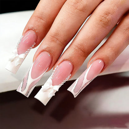Artificial nail set with elegant bow and pearl decorations Acalora