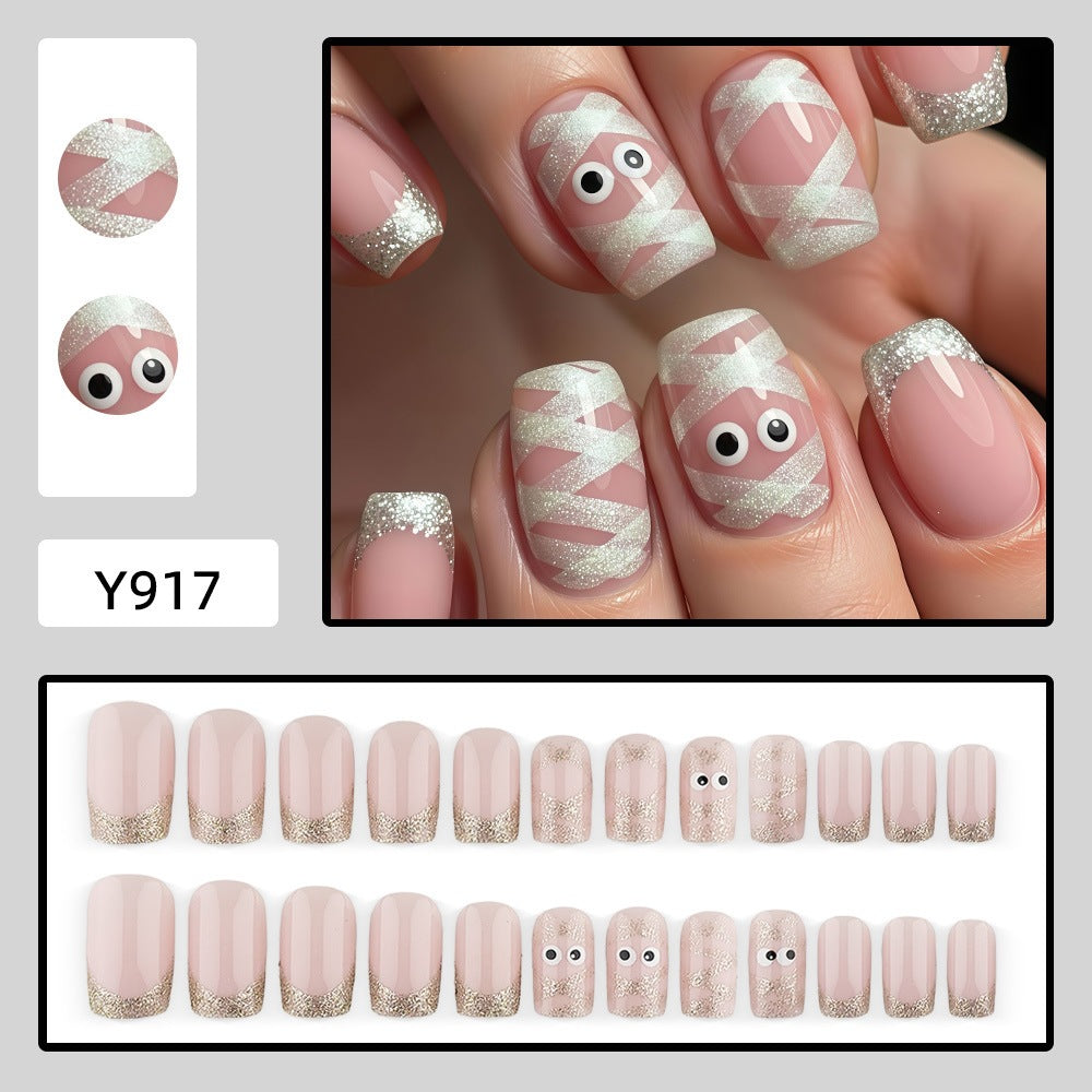 Artificials nails with playful eye design and glitter tips Acalora