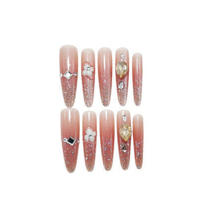 Artificial nail set with glitter and flower accents Acalora