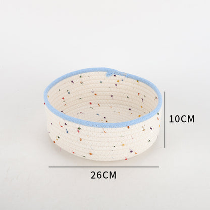 Storage basket made of natural cotton fabric with colorful dots