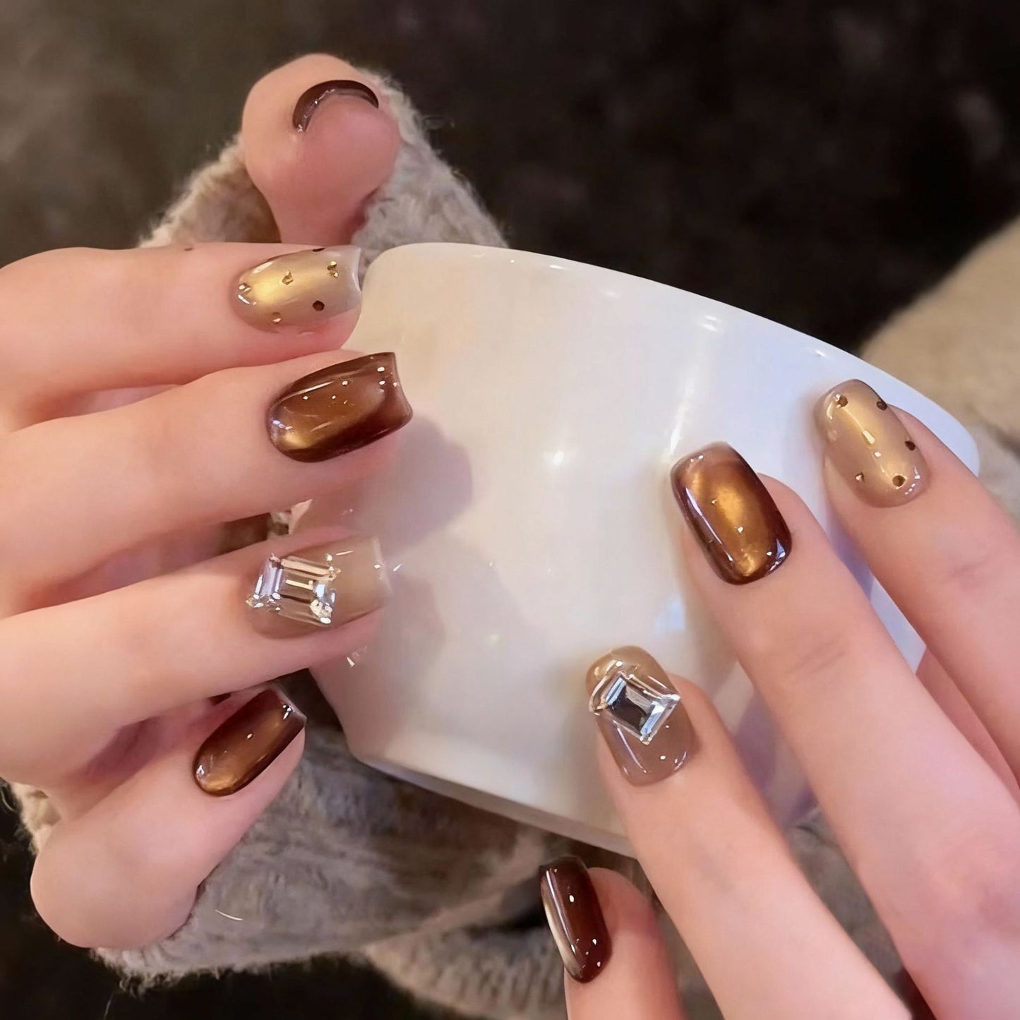 Acrylic nail set with elegant ombre designs and sparkling accents Acalora