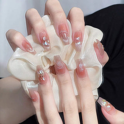 Nail art set with elegant wave patterns and delicate pearl accents Acalora