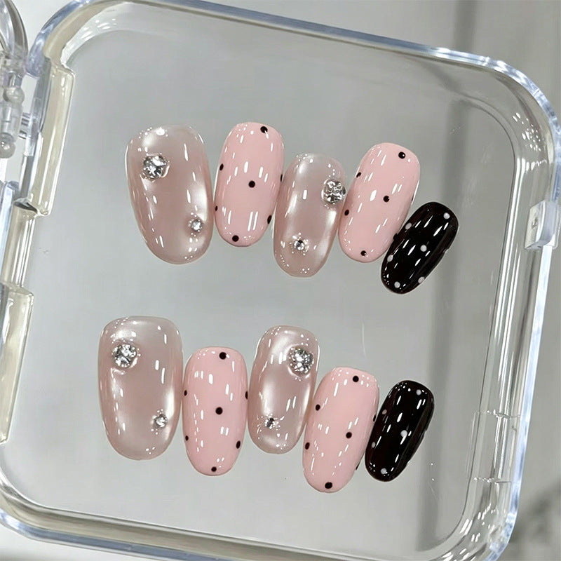 Acrylic nail set with glamorous rhinestone accents and modern dots Acalora