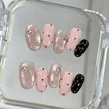 Acrylic nail set with glamorous rhinestone accents and modern dots Acalora