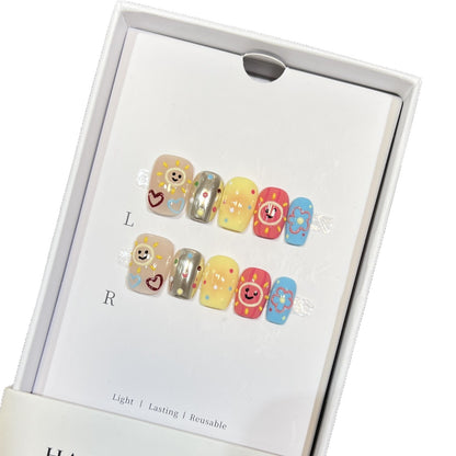 Whimsical Press-On Nail Art Set with Smiley Faces and Floral Designs Acalora