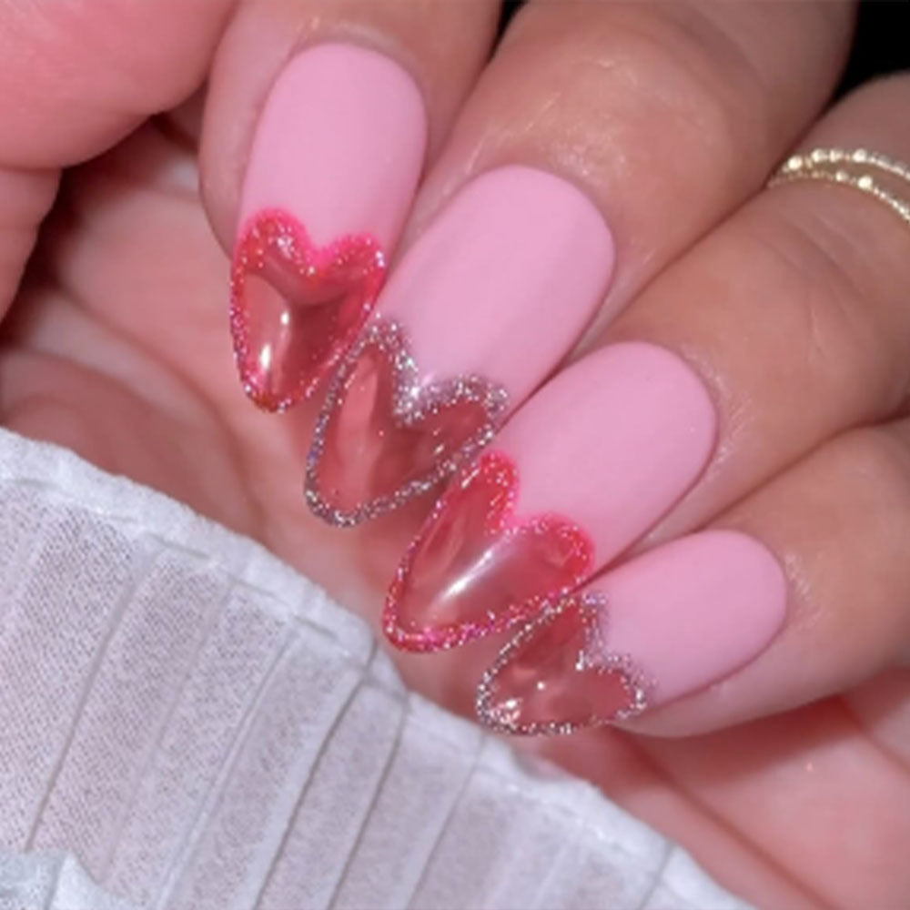 Art nails with heart design and glitter accents Acalora