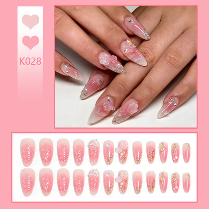 Artificial nail creation with floral 3D details and glitter accents Acalora