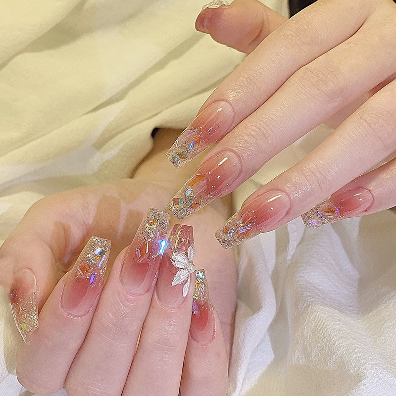 Artificial nail set with floral and glittering accents Acalora