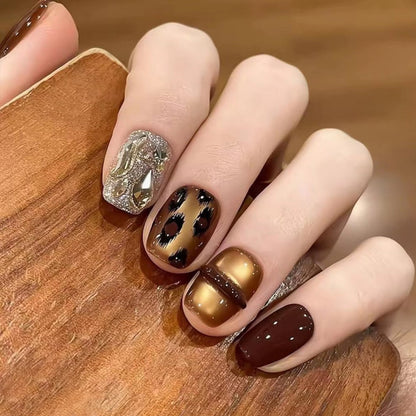 Glamorous artificial nails with animal design and glitter accents Acalora