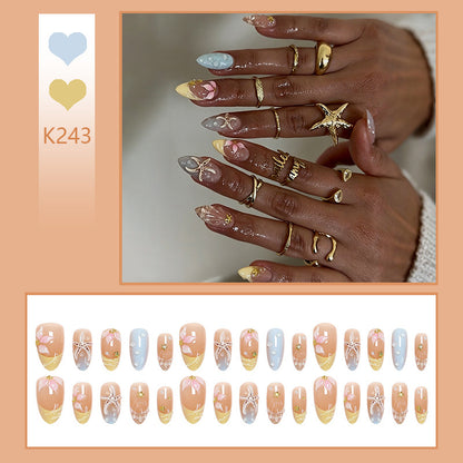 Artificial nail set with floral motifs and glitter accents Acalora