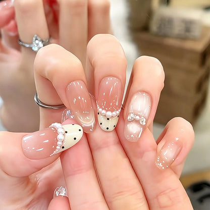 Artificial nail set with elegant French design and delicate pearl embellishments Acalora