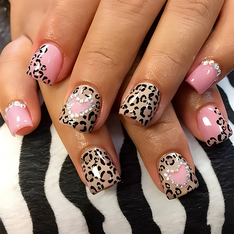 Glamorous artificial nail collection with animal motif and crystal embellishments Acalora