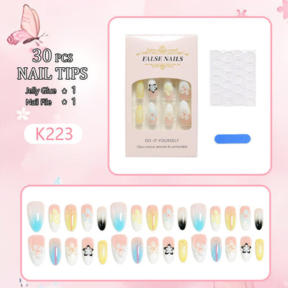 Artificial nail set with floral and glittering decorations Acalora
