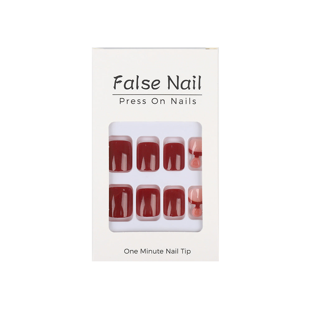 Acrylic nail set in elegant red and nude design Acalora