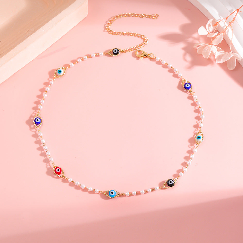 Elegant Pearl and Eye Charm Necklace Acalora