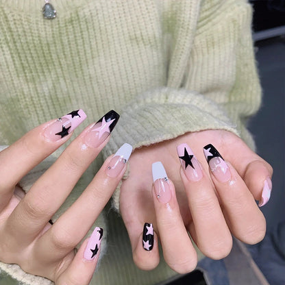Artificial nail set with glamorous star design and sparkling accents Acalora