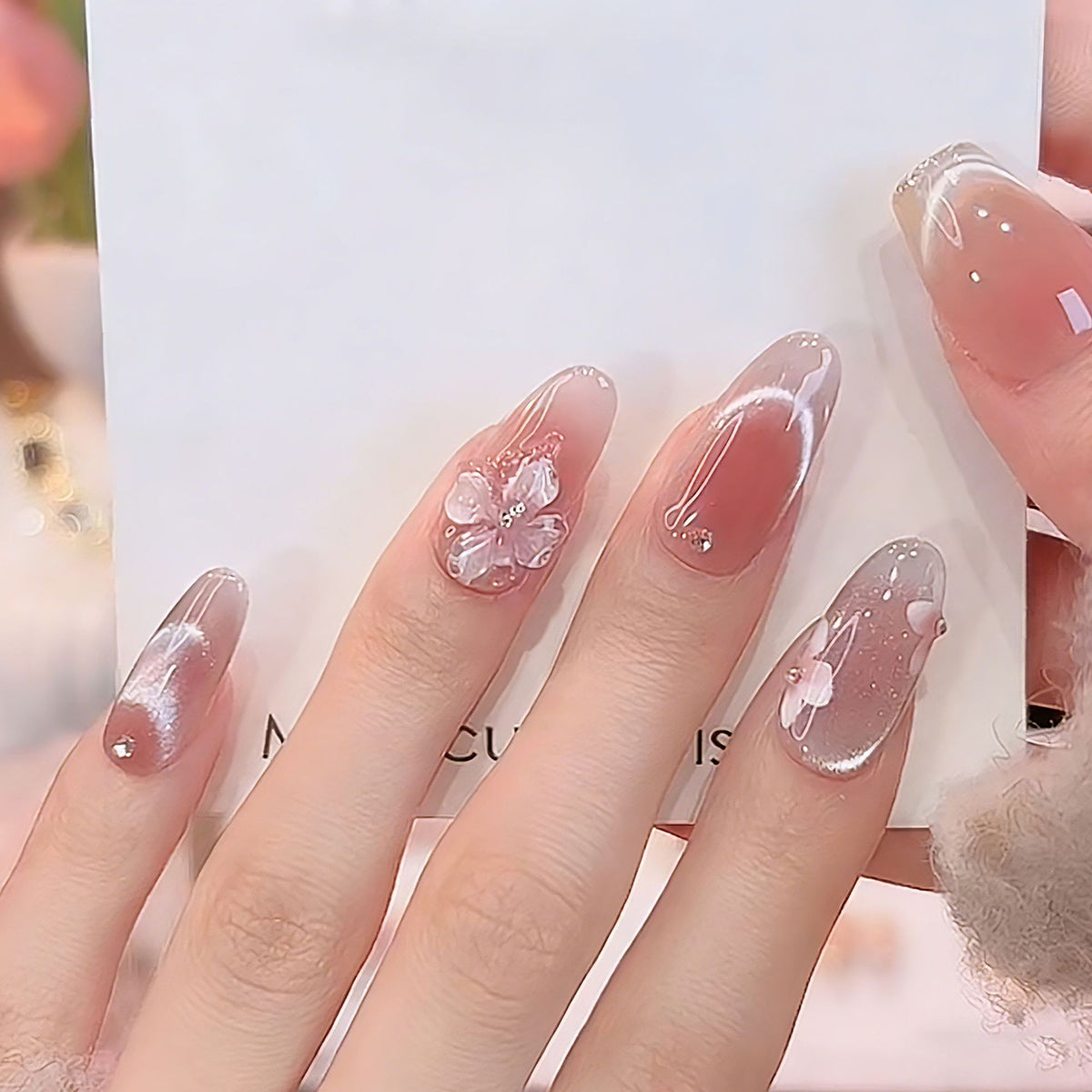 Artificial nail set with festive gift design and elegant glitter accents Acalora