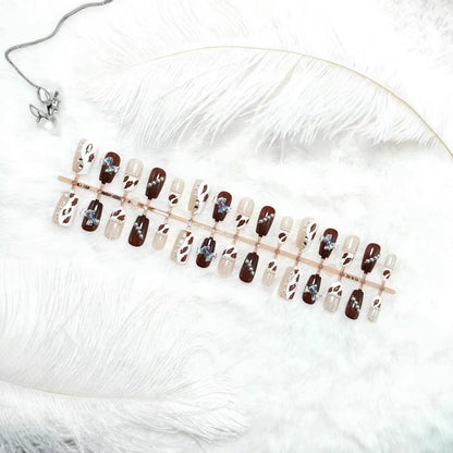 Artificial nails with sparkling rhinestone and bow accents Acalora