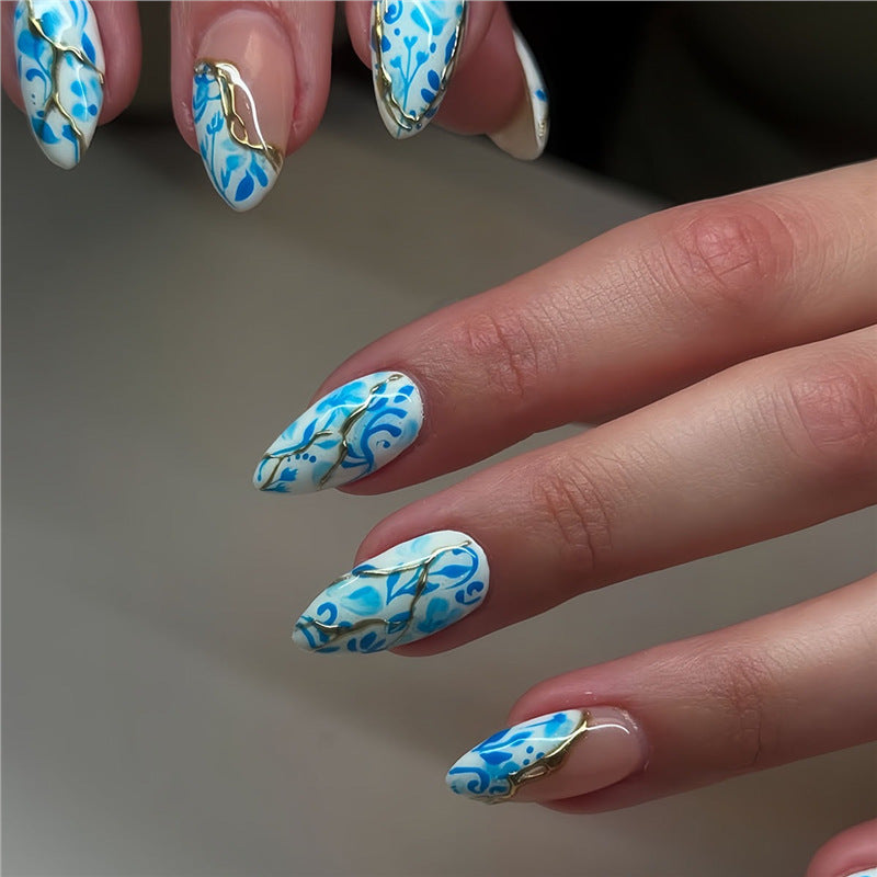 Artistic Floral Press-On Nail Design with Gold Accents Acalora