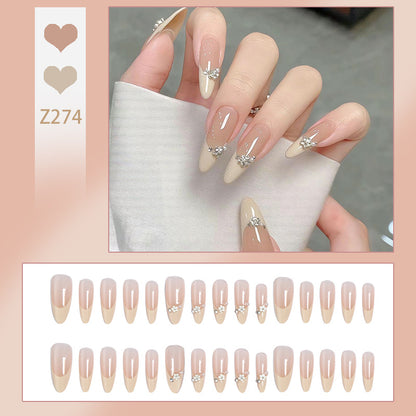Acrylic nail set with elegant tips and sparkling appliqués Acalora