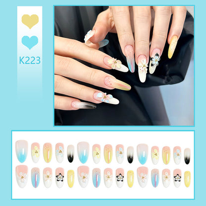 Artificial nail set with floral and glittering decorations Acalora