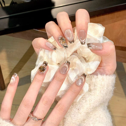 Artificial nail set with glamorous gold and glitter accents Acalora