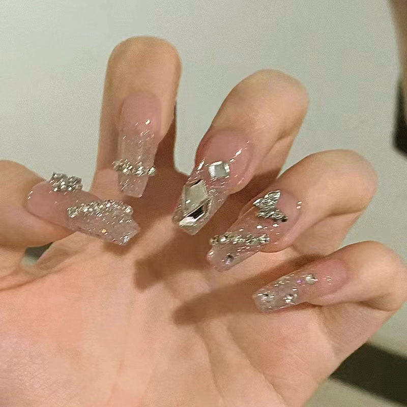Glamorous artificial nails with sparkling rhinestones and elegant designs Acalora
