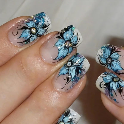 Artificial nail set with intricate floral designs and glitter elements Acalora