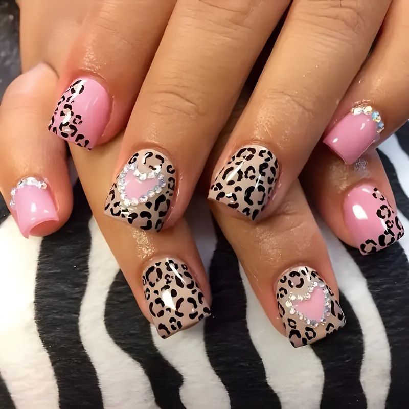 Glamorous artificial nail collection with animal motif and crystal embellishments Acalora
