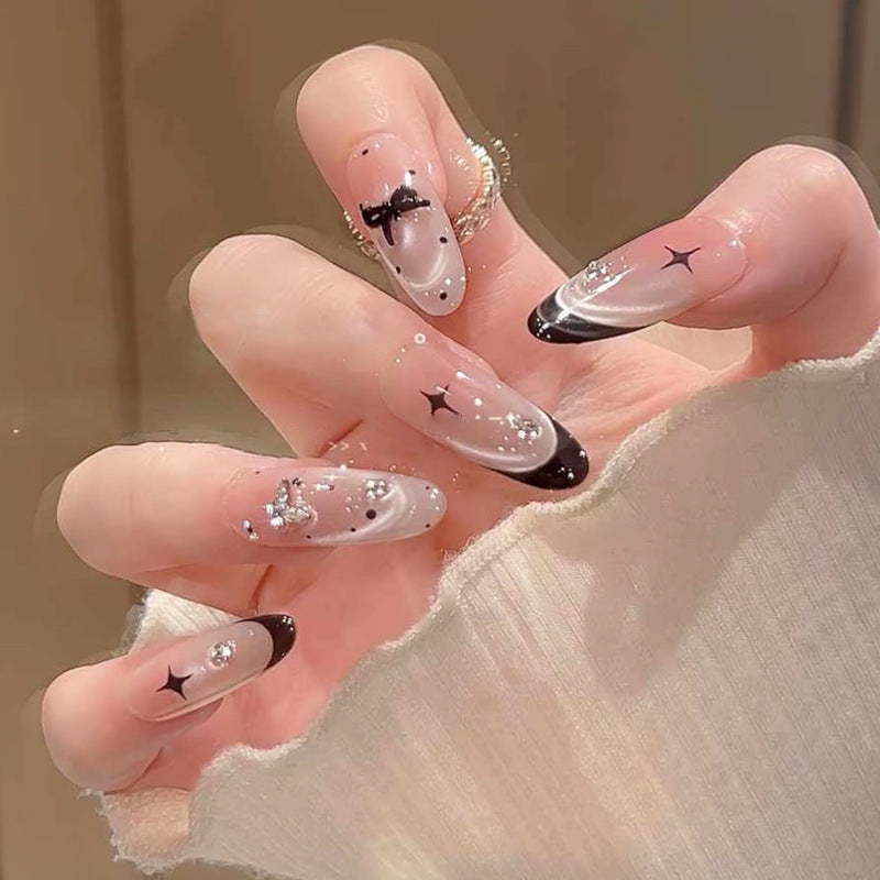 Nail art set with elegant black and white design and sparkling applications Acalora