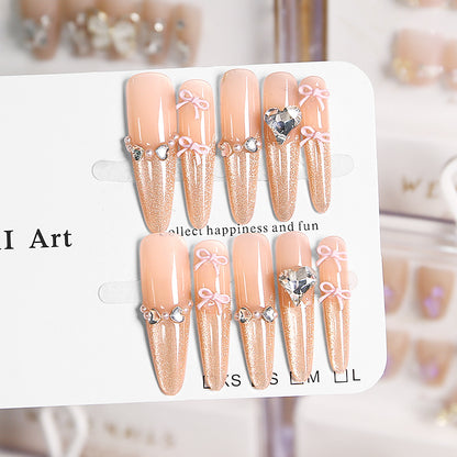 Art nail set with sparkling tips and delicate bow decorations Acalora