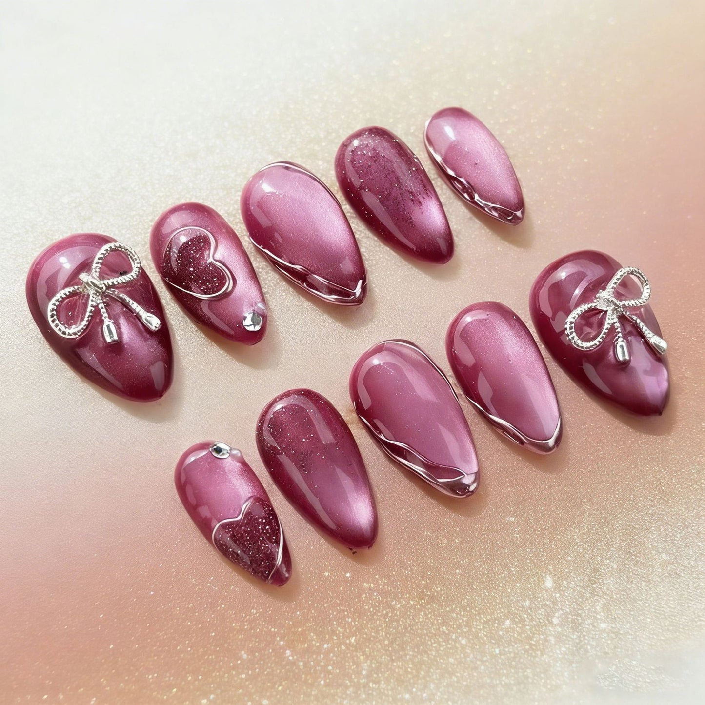Acrylic nail set with elegant heart and bow decorations Acalora