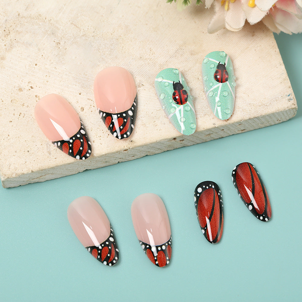 Creative nail art with elaborate butterfly and flower designs Acalora