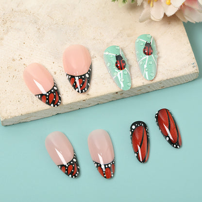 Creative nail art with elaborate butterfly and flower designs Acalora