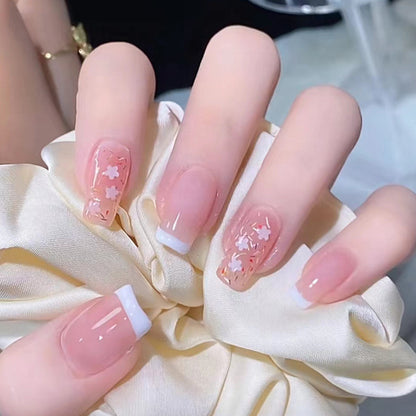 Nail art set with floral decorations and elegant French design Acalora
