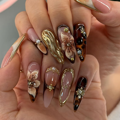 Artistic Stiletto Press-On Nail Art with Floral and Gemstone Accents Acalora