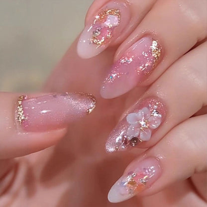 Art nail design with floral accents and glitter tips Acalora