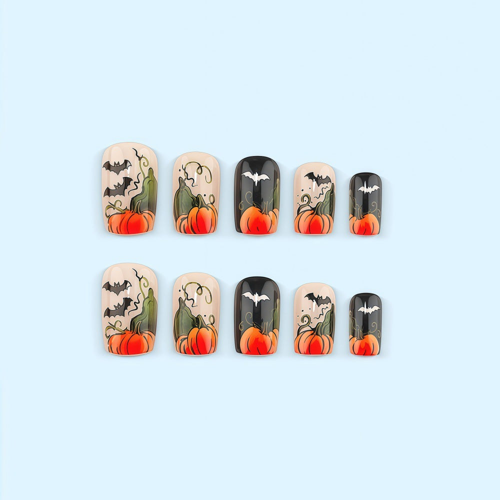 Artificial nails in Halloween design with pumpkins and ghosts Acalora